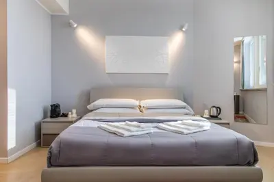 Letto o letti in una camera di Golgi Suite
