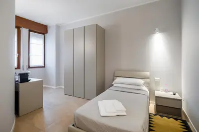 Letto o letti in una camera di Golgi Suite