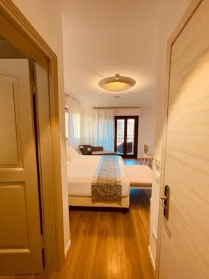Letto o letti in una camera di Grand Hotel San Lorenzo