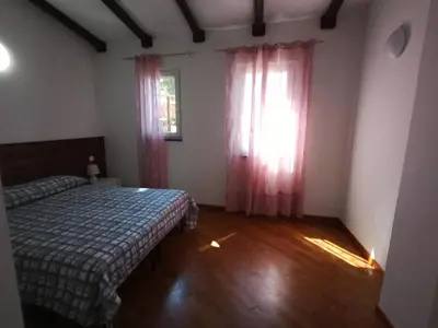 Letto o letti in una camera di Agriturismo U muinettu