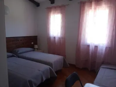 Letto o letti in una camera di Agriturismo U muinettu