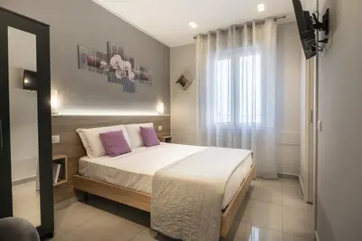 Letto o letti in una camera di Affittacamere Orchidea for Tourists Hesperia Hosp