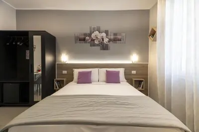 Letto o letti in una camera di Affittacamere Orchidea for Tourists Hesperia Hosp