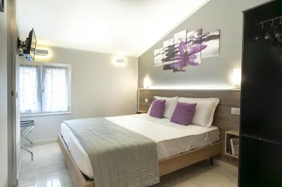 Letto o letti in una camera di Affittacamere Orchidea for Tourists Hesperia Hosp