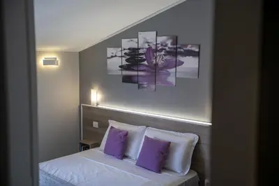 Letto o letti in una camera di Affittacamere Orchidea for Tourists Hesperia Hosp