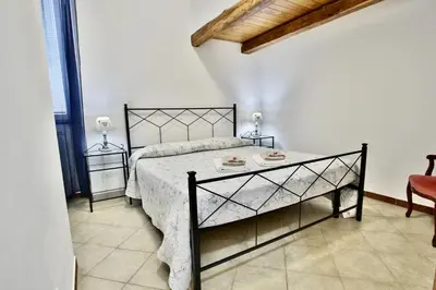 Letto o letti in una camera di appartamento cielo&terra2