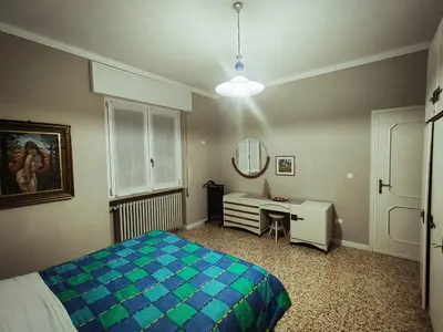 Letto o letti in una camera di Le Aquile
