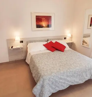 Letto o letti in una camera di Affittacamere L'Orto dei nonni