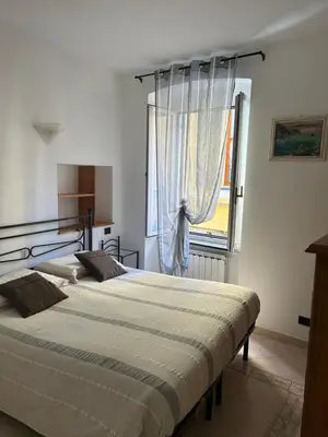 Letto o letti in una camera di Appartamento in tipico carugio ligure