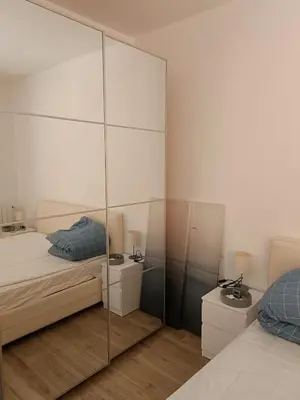 Letto o letti in una camera di M'illumino d'immenso - MONEGLIA APARTMENTS