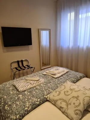 Letto o letti in una camera di RESIDENZA VENTURINI 2.0