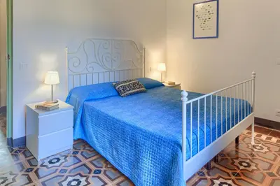 Letto o letti in una camera di Leone I and Leone II Apartments
