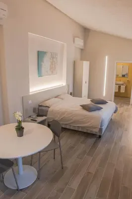 Letto o letti in una camera di Hotel Cavallo Bianco