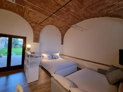 Letto o letti in una camera di DIMORA DESENZANI - Lago di Garda