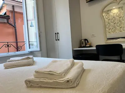 Letto o letti in una camera di Affittacamere Sull'Arco