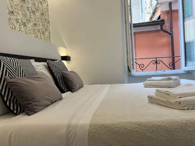 Letto o letti in una camera di Affittacamere Sull'Arco
