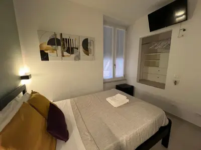 Letto o letti in una camera di Affittacamere Sull'Arco