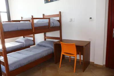 Letto o letti in una camera di Student's Hostel Parma