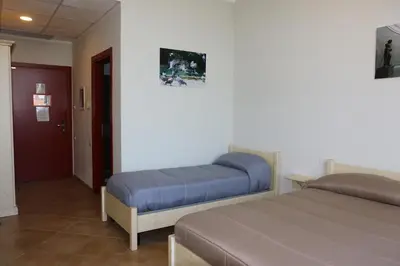 Letto o letti in una camera di Student's Hostel Parma