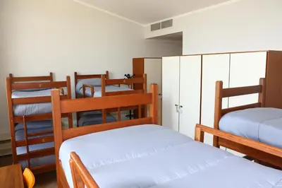 Letto o letti in una camera di Student's Hostel Parma
