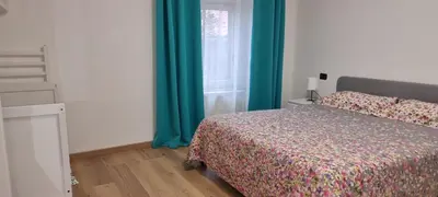 Letto o letti in una camera di CASA VACANZA CON PISCINA,AREA GIOCHI BAMBINI.