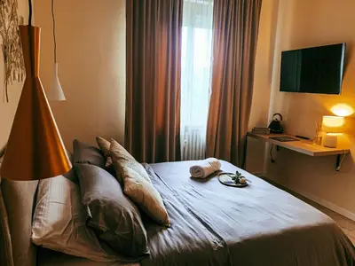 Letto o letti in una camera di B&B SALUS CIVICO 23