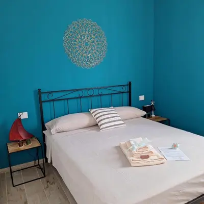 Letto o letti in una camera di Toson d'Oro Bed & Breakfast