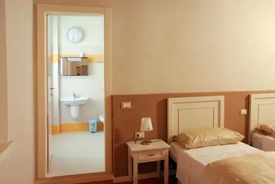 Letto o letti in una camera di Ostello La Canonica