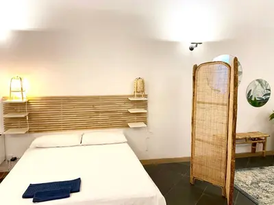 Letto o letti in una camera di The Jungle Apartment