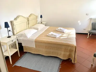 Letto o letti in una camera di AGRITURISMO CASA OLIVIERI