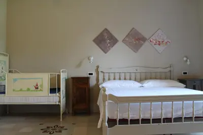 Letto o letti in una camera di Agriturismo Battibue
