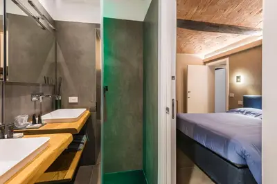 Letto o letti in una camera di Torre 13