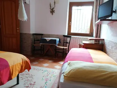 Letto o letti in una camera di Casa Mary