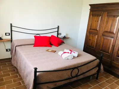 Letto o letti in una camera di Agriturismo LA VECCHIA CASCINA