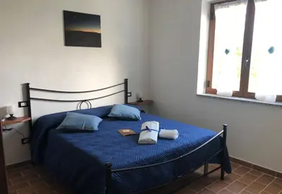 Letto o letti in una camera di Agriturismo LA VECCHIA CASCINA