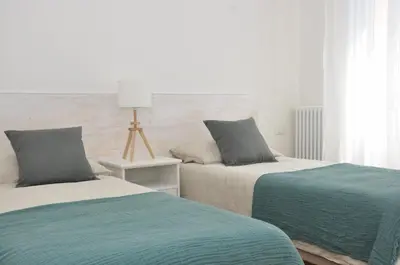 Letto o letti in una camera di Verdi Due