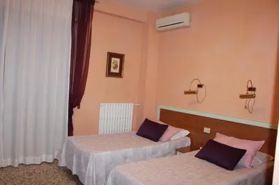 Letto o letti in una camera di Hotel San Donnino