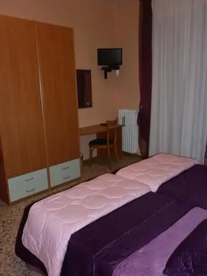 Letto o letti in una camera di Hotel San Donnino