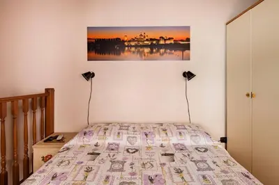 Letto o letti in una camera di BellaMantova 3