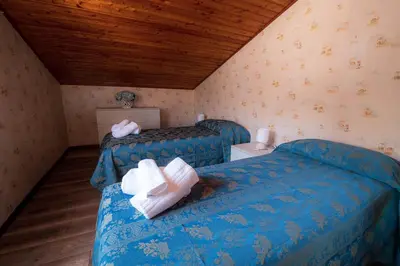 Letto o letti in una camera di Casa Vacanze Dante