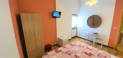 Letto o letti in una camera di B&B Le Quattro Stagioni