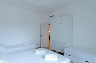Letto o letti in una camera di JOIVY Spacious 2-bedroom flat with Balcony near Beach in Sestri Levante