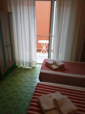 Letto o letti in una camera di Albergo Stella Di Mare