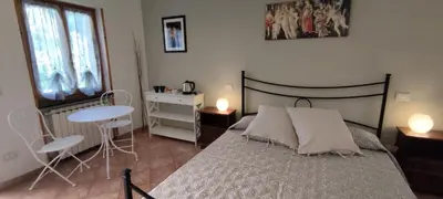 Letto o letti in una camera di Affittacamere Angela
