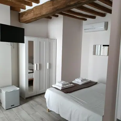 Letto o letti in una camera di Residenza Borgo Guazzo