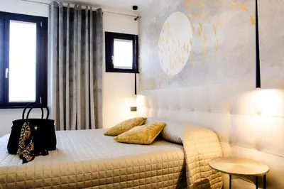 Letto o letti in una camera di Bellevue - Rooms & Suites