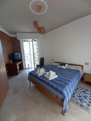 Letto o letti in una camera di TERRAZZA SUL MARE IN VIA DEVOTO