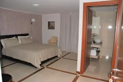 Letto o letti in una camera di Villa Auditorium
