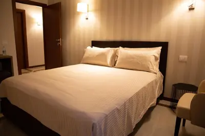 Letto o letti in una camera di Villa Auditorium