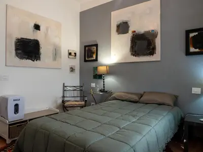 Letto o letti in una camera di Cinque terre affittacamere Atelier ouvert!